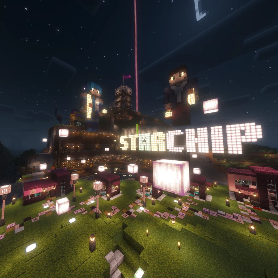 The illuminated Starchip plaza and character statues at night