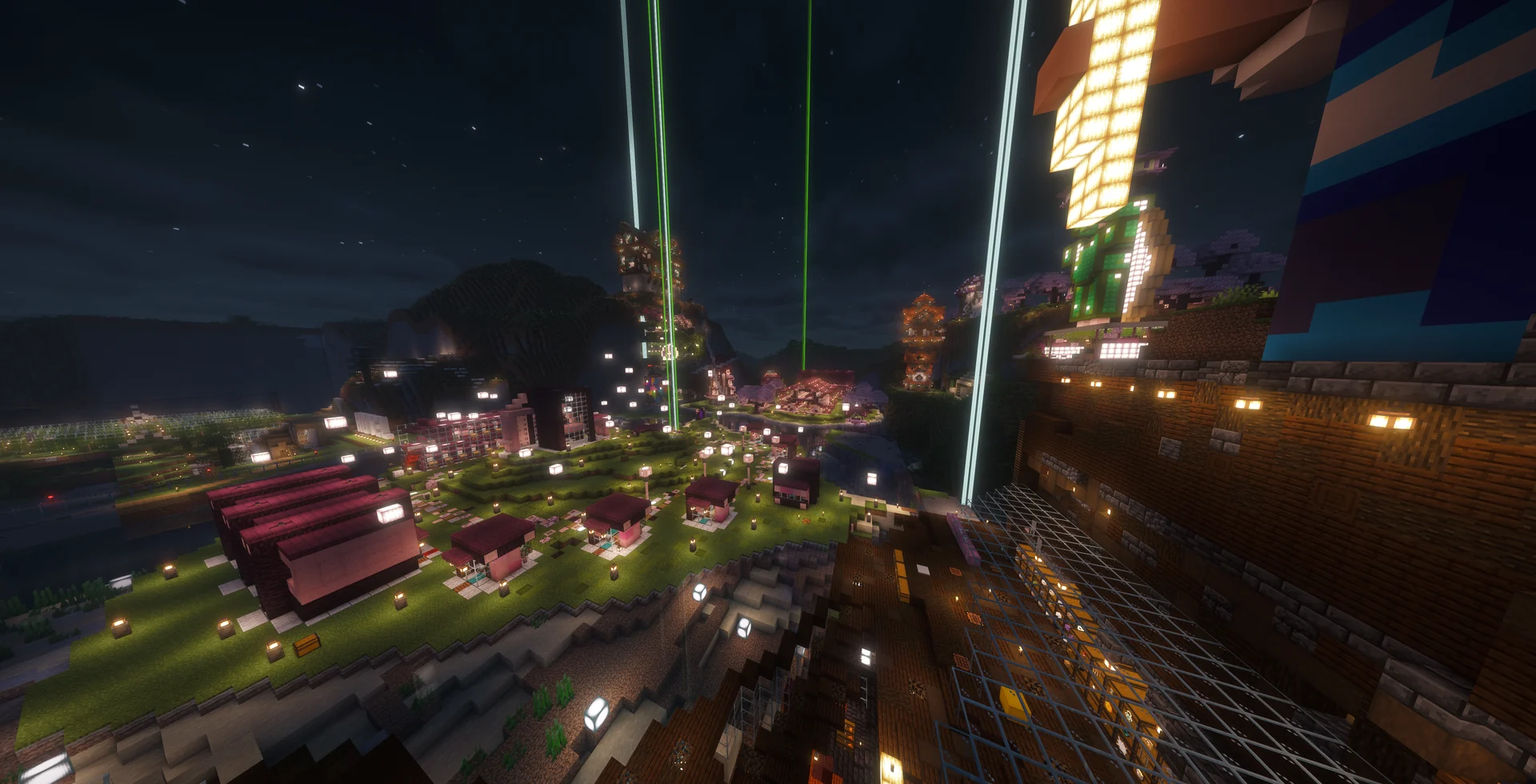 A wide nighttime overlook of the Starchip plaza and beacon lights